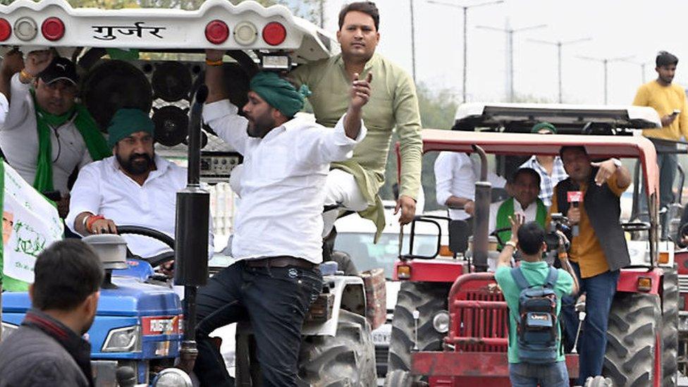 Demonstrators on tractors travel along the Yamuna Expressway during a protest organized by farmers in Noida, India, 26 February 2024