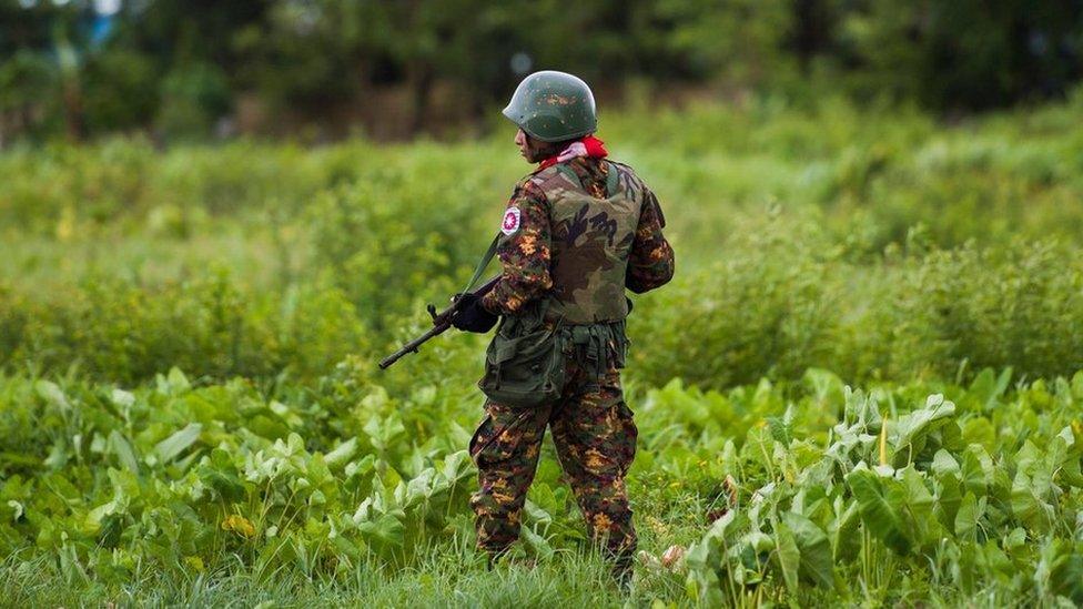 A Myanmar soldier stands on guard in Rakhine state in 2018