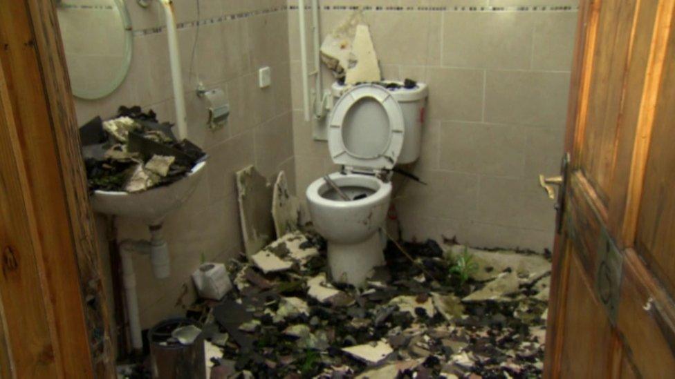 A damaged toilet in the burnt-out Orange hall in Newtoncunningham