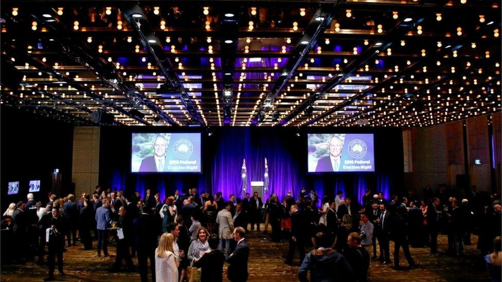 Prime Minister Malcolm Turnbull's image is displayed on a screen at an official Liberal Party function in Sydney