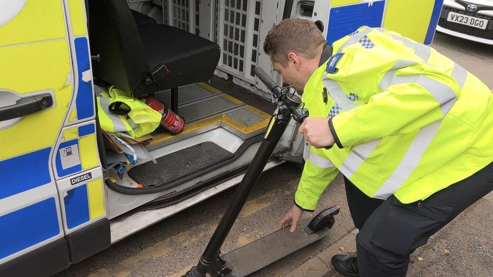 Police officer with e-scooter