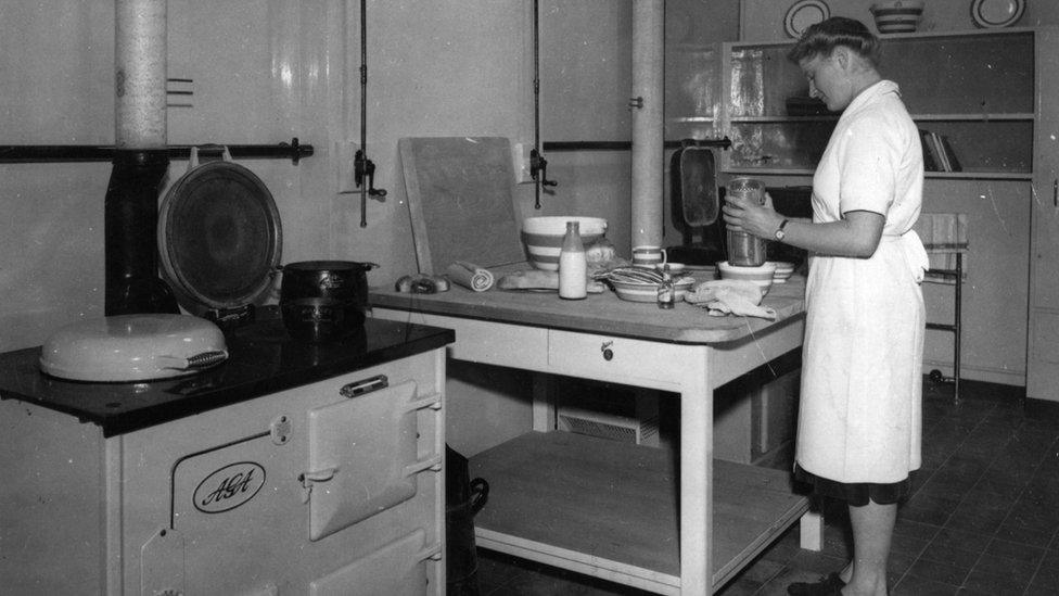 Woman using an Aga