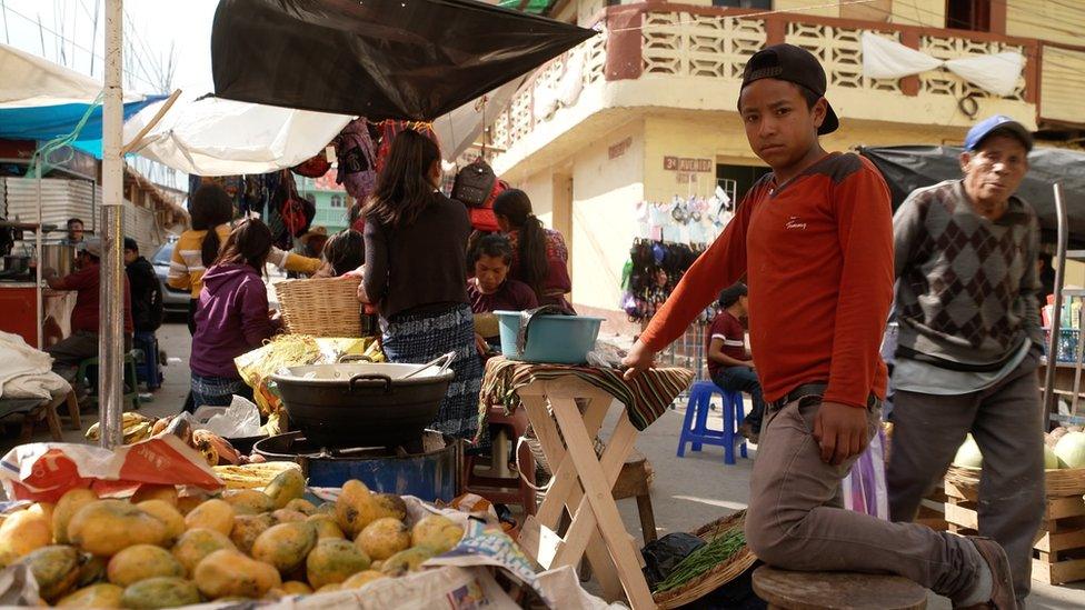 Boy at a stall in Comitancillo