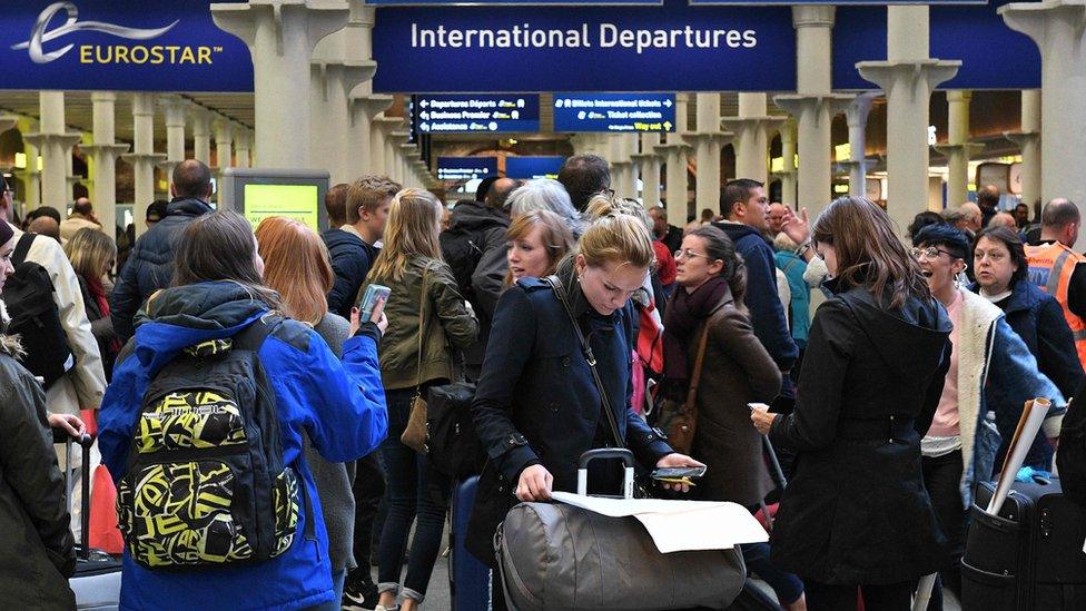 Passengers queuing at London St Pancras station