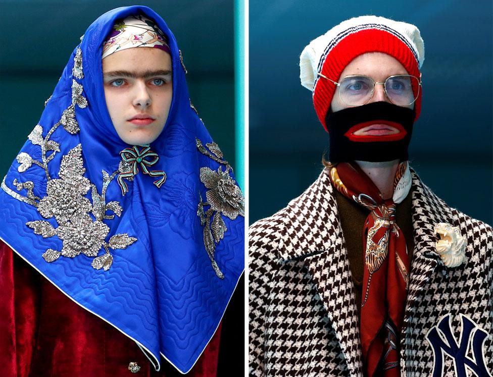 Two models on the catwalk, one wearing a bright blue headscarf with silver floral stitching and the other wearing a woolly hat, balaclava and glasses