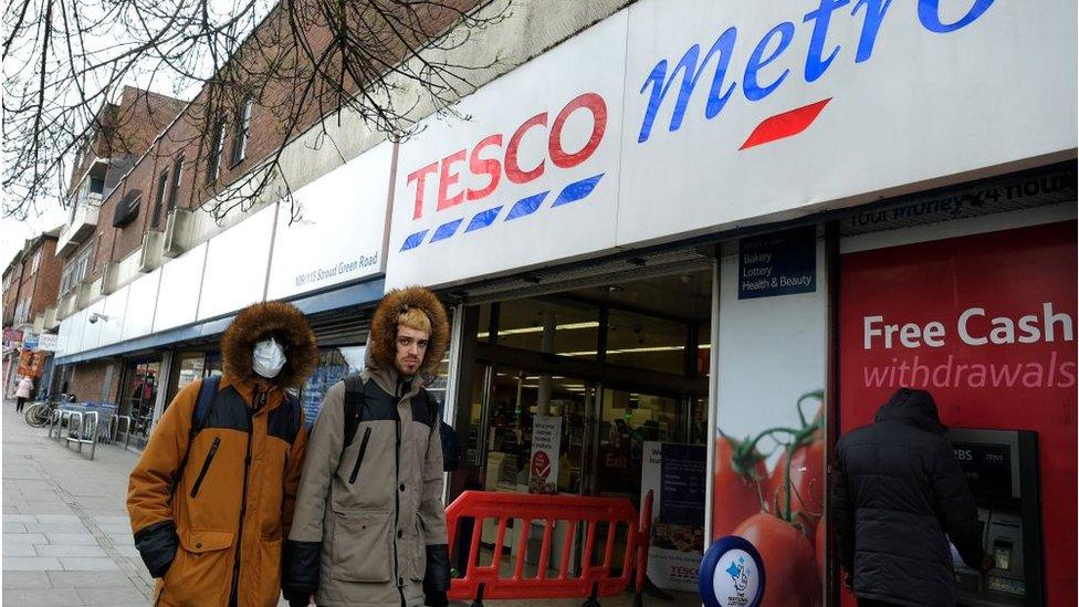 Shoppers outside a Tesco