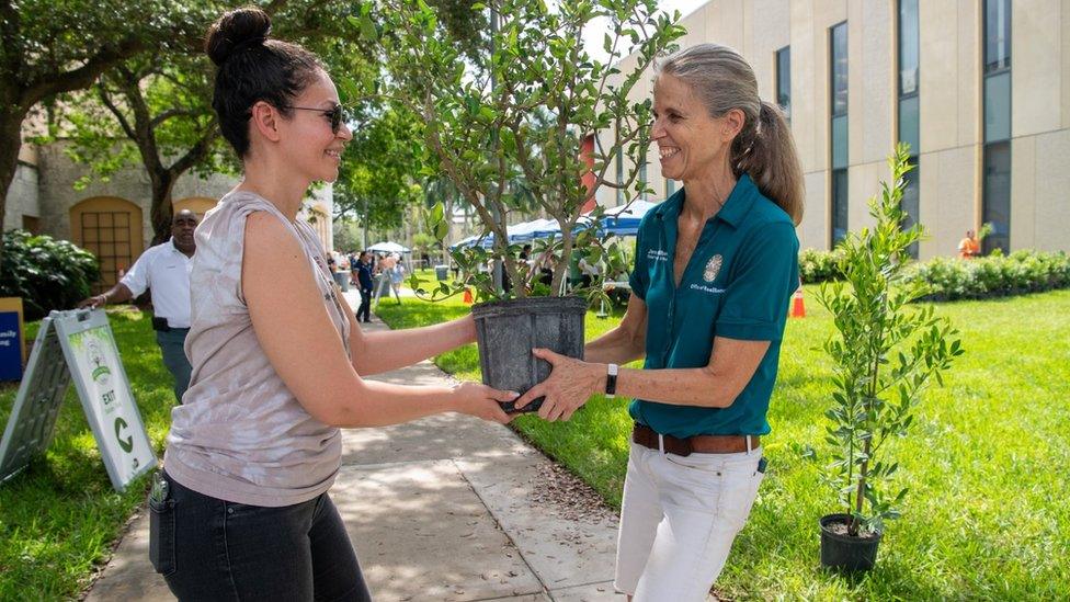 Chief Heat Officer Jane Gilbert speaking to community members at a tree planting event in an urban heat island area