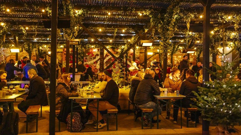 People eating in a decorative food venue