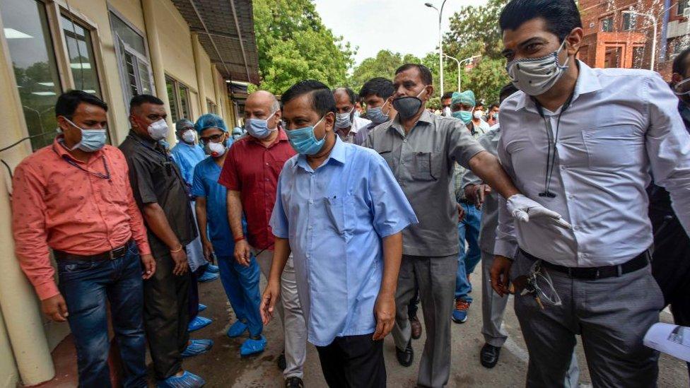 Delhi Chief Minister Arvind Kejriwal (c) visits Lok Nayak Jai Prakash Narayan Hospital to inaugurate the Covid-19 helpdesk on June 25, 2020 in New Delhi, India.