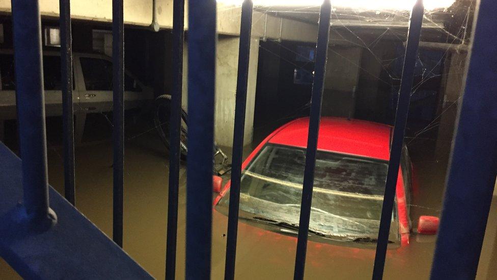 Car overwhelmed by flooding