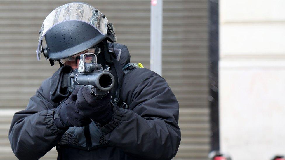 File pic of police officer with LBD40 gun