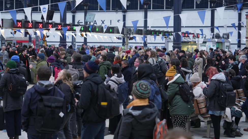 Passengers waiting at Brighton Station