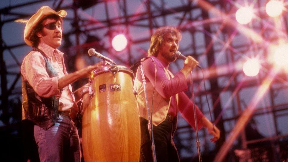 Singer Ray Sawyer and guitarist Dennis Locorriere American rock band Dr. Hook performing at the Schaefer Music Festival at the Wollman Rink in Central Park on August 22, 1979 in New York City