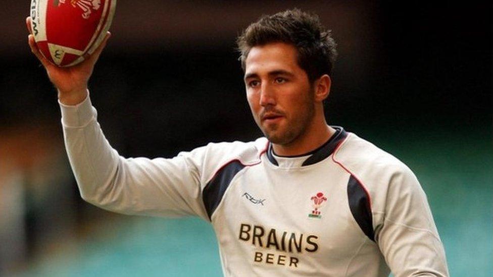 Gavin Henson in kit with Brains logo, holding rugby ball