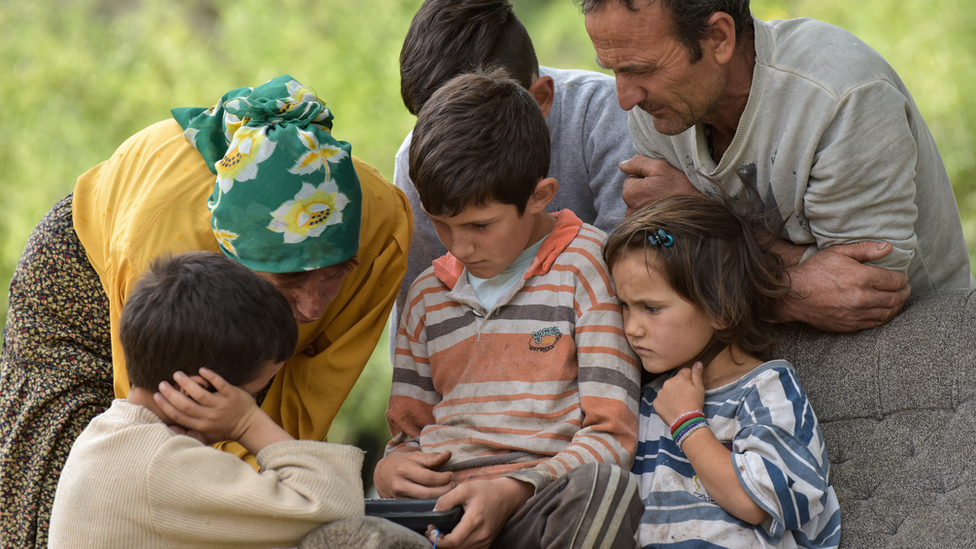 Hatidze, the father of the Sam family, Hussein, and some of his children