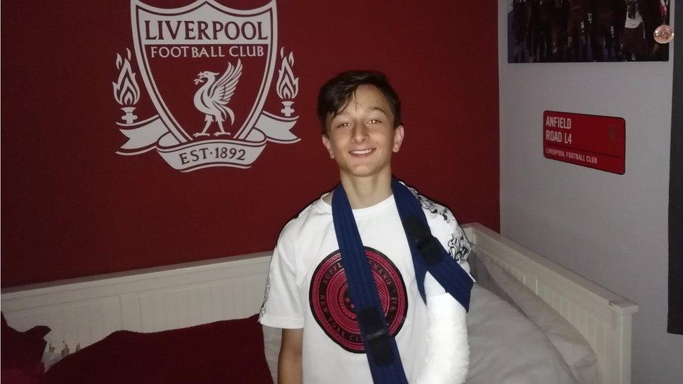 Liverpool FC fan Jacob with broken arm