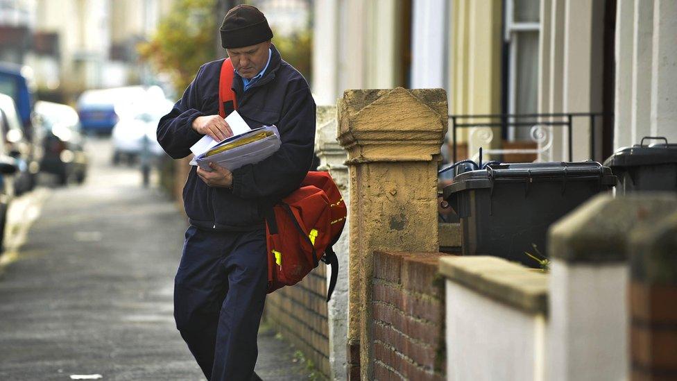 A postman delivering mail