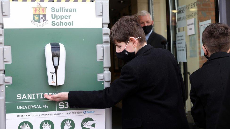 Post-primary pupil uses hand sanitiser