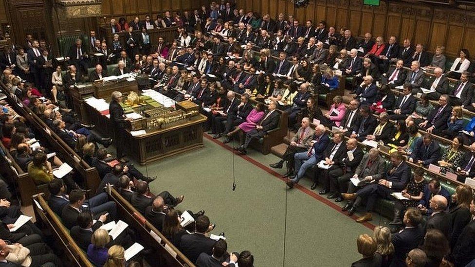 Theresa May addressing MPs in the House of Commons