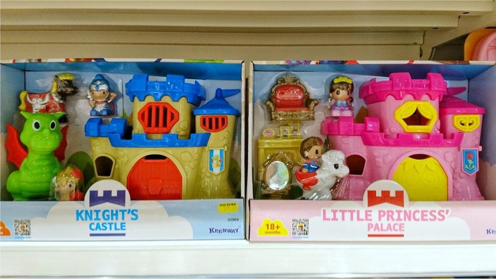 Two toys - one is a knight's castle, the other is a princess's palace