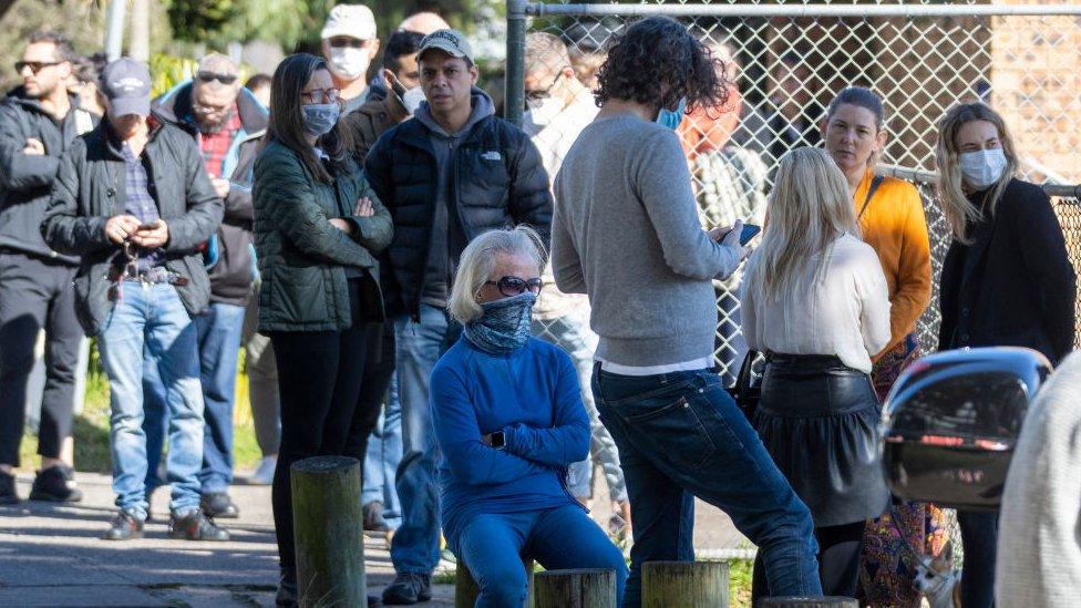 People in Sydney queueing for a virus test