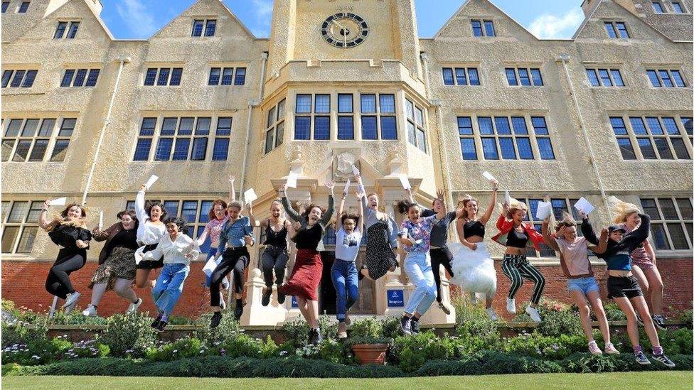 Girls jumping with A-level result papers - Roedean School