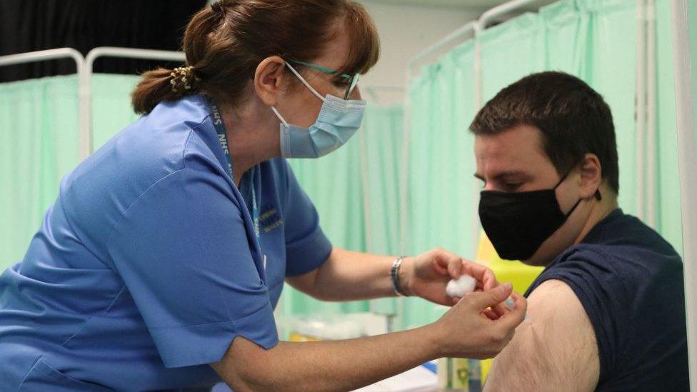 A man gets vaccinated