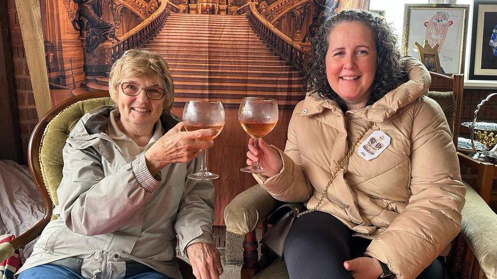 Two women holding wine glasses