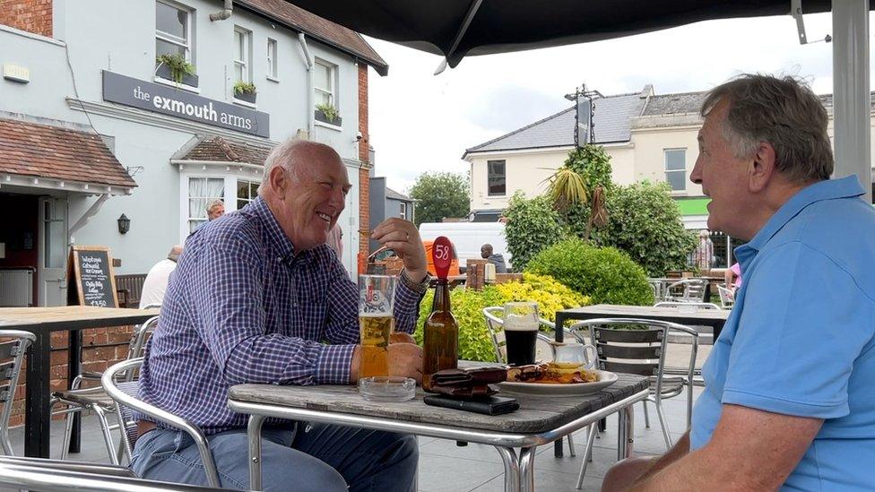 People eating lunch in a pub garden