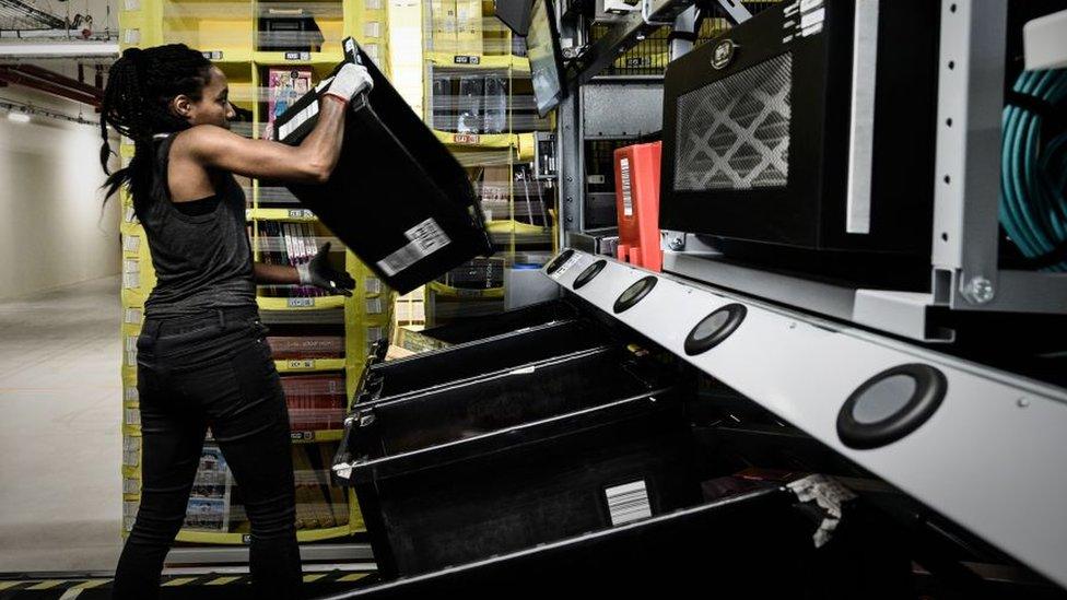 A worker at an Amazon warehouse in France