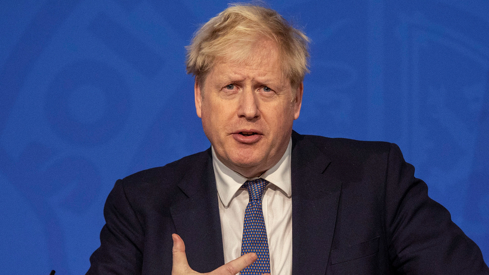 Boris Johnson speaks during a virtual press conference to update the nation on the status of the pandemic in the Downing Street briefing room in central London on January 4, 2022