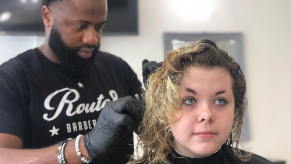 Sylvester King cutting hair