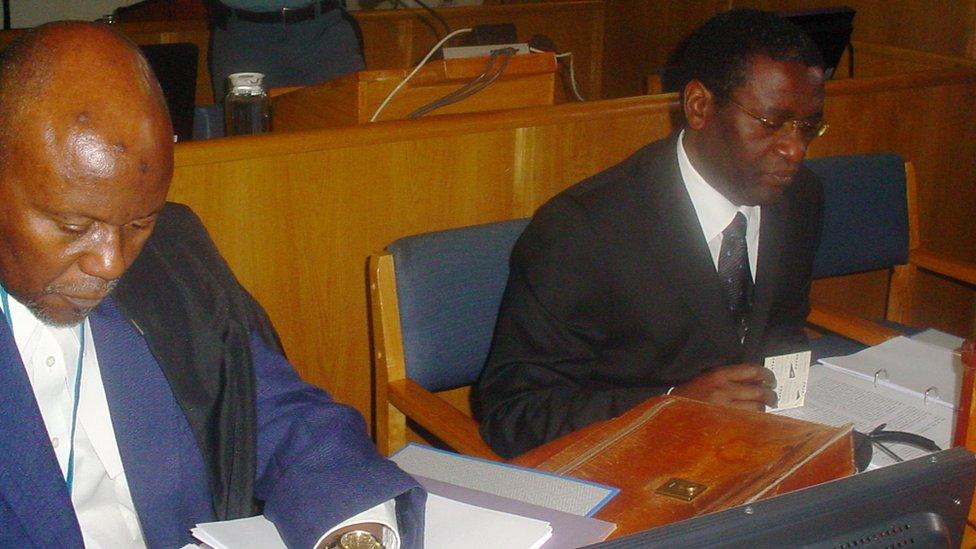 A picture taken on October 10, 2008 shows former Rwandan planning minister Augustin Ngirabatware (R) next to his lawyer Cecil John Maruma (L) during his first appearance before the International Criminal Tribunal for Rwanda (ICTR) in Arusha.