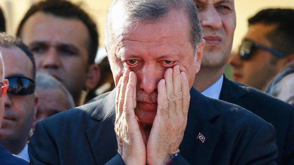 Turkish President Recep Tayyip Erdogan wipes his tears during funeral of people killed while protesting the attempted coup against Turkey's government in Istanbul on 17 July