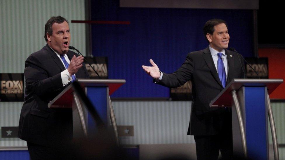 Republican US presidential candidate Christie and Rubio speak simultaneously during the Fox Business Network Republican presidential candidates debate in North Charleston