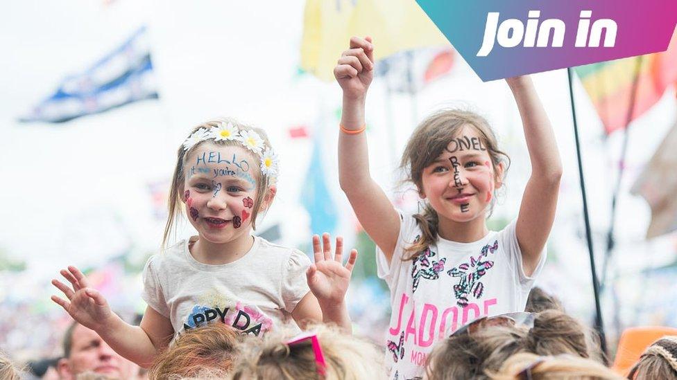 Children enjoy the music at the Glastonbury Festival