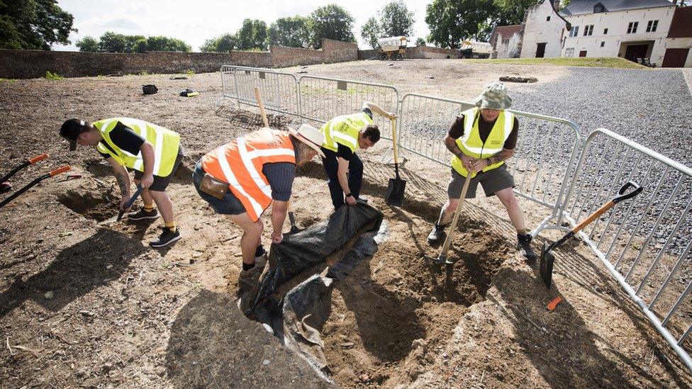 Members of the Waterloo Uncovered team are seen at work