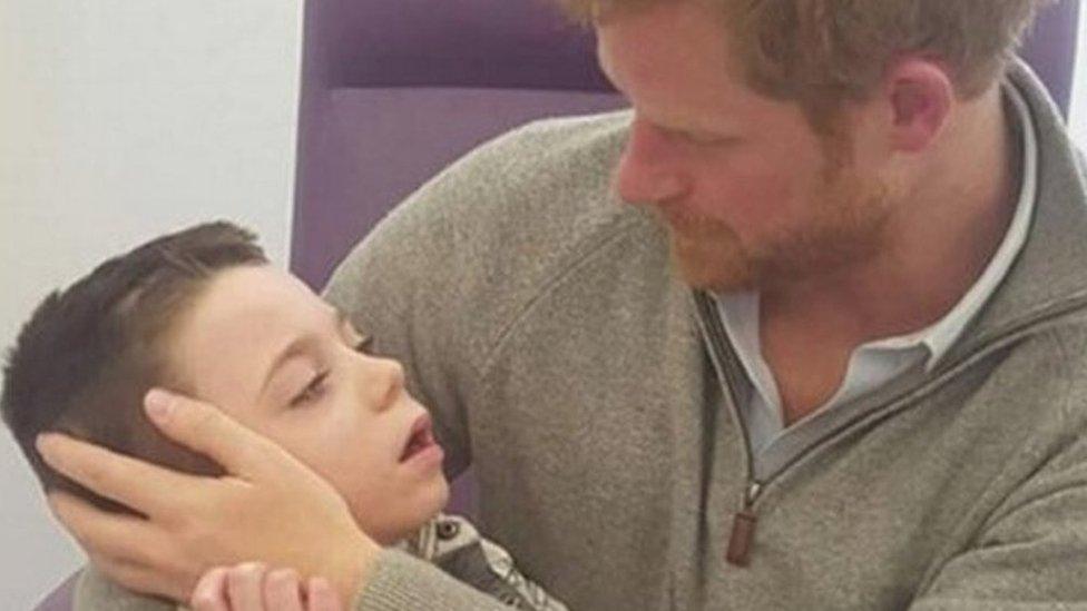 Prince Harry with Ollie Carroll during his private visit to Great Ormond Street Hospital