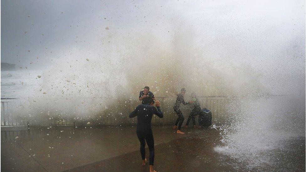 Children are soaked by huge waves at Bronte Beach