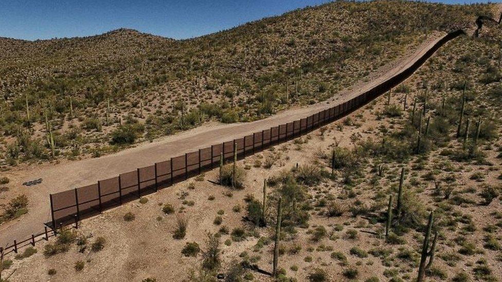 View of the metal fence along the border in Sonoyta, Sonora state, northern Mexico, between the Altar desert in Mexico and the Arizona desert in the United States (27 March 2017)