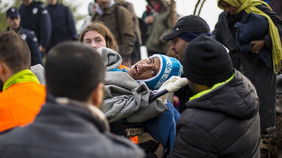 A disabled man being carried