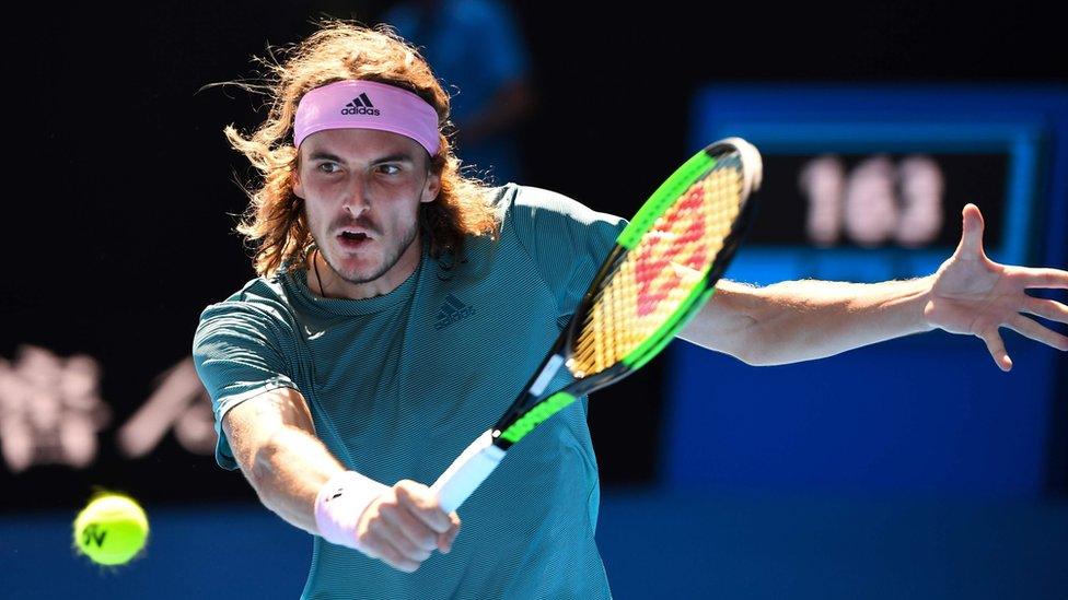 Stefanos Tsitsipas hits a return against Spain's Roberto Bautista Agut during their men's singles quarter-final match on day nine of the Australian Open tennis tournament