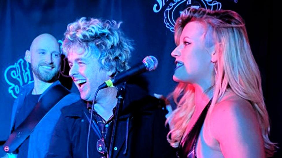 Pete Biggin, guitarist, Billie Joe Armstrong, and Kerry Glass on stage at small London pub