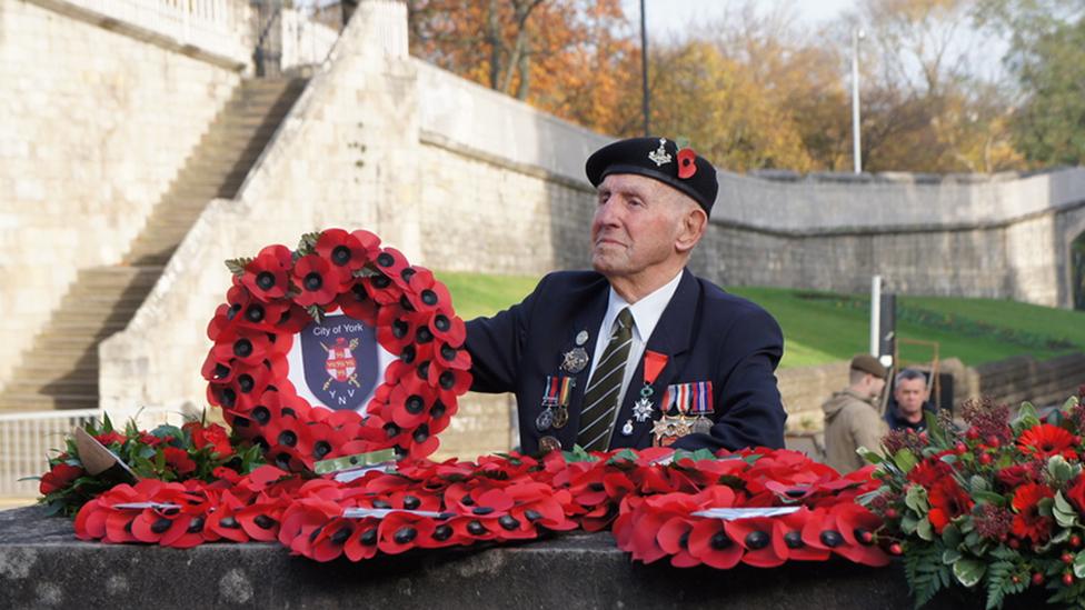 Veteran laying a wreath