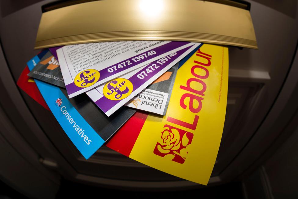 A selection of political leaflets from the 2015 election posted through a letterbox