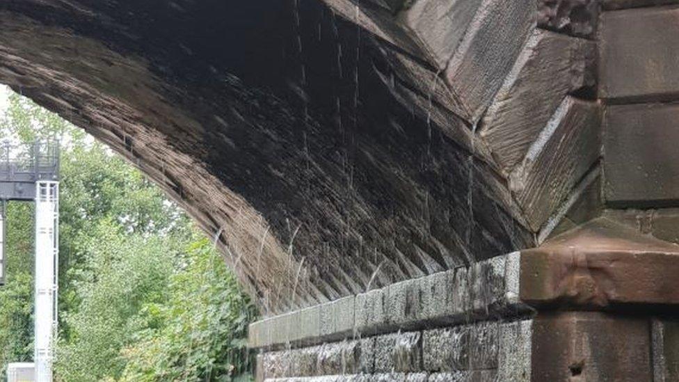 Water seeps through Alfreton Road railway bridge