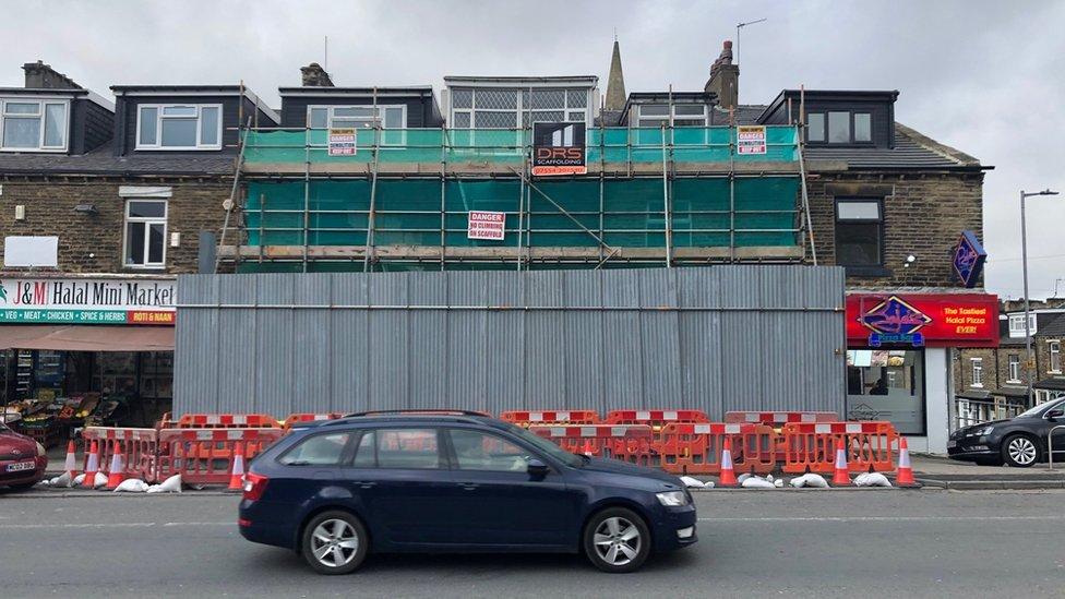 Boarded up shops on Keighley Road