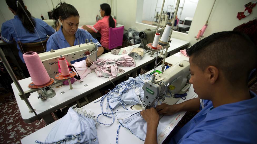 Workers making Agua Bendita clothing