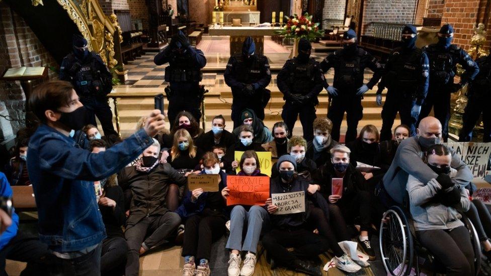 Protesters stage a sit-in at the Archcathedral Basilica of St Peter and St Paul in Poznan, Poland