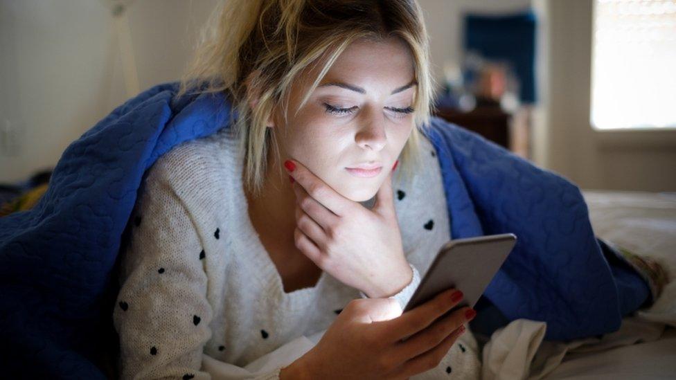 Woman checking smartphone